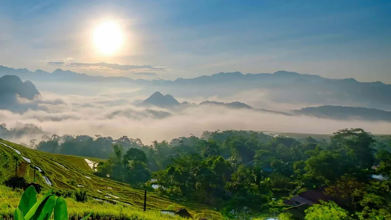 Sunrise over mist-covered valleys and terraced rice fields in Pu Luong Nature Reserve.